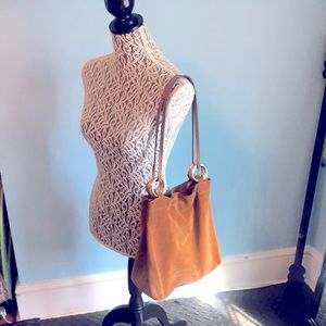 TORY BURCH. TAN suede bag. Great condition. Gold accent rings.Used t…